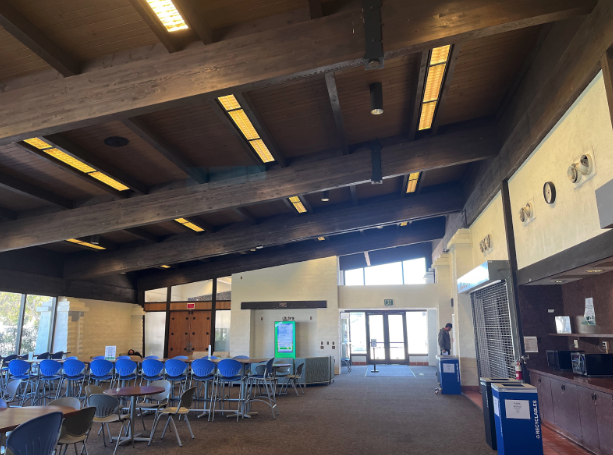 The cafeteria sits mostly empty with grates pulled down over what used to be the Cuesta College Cafe.
